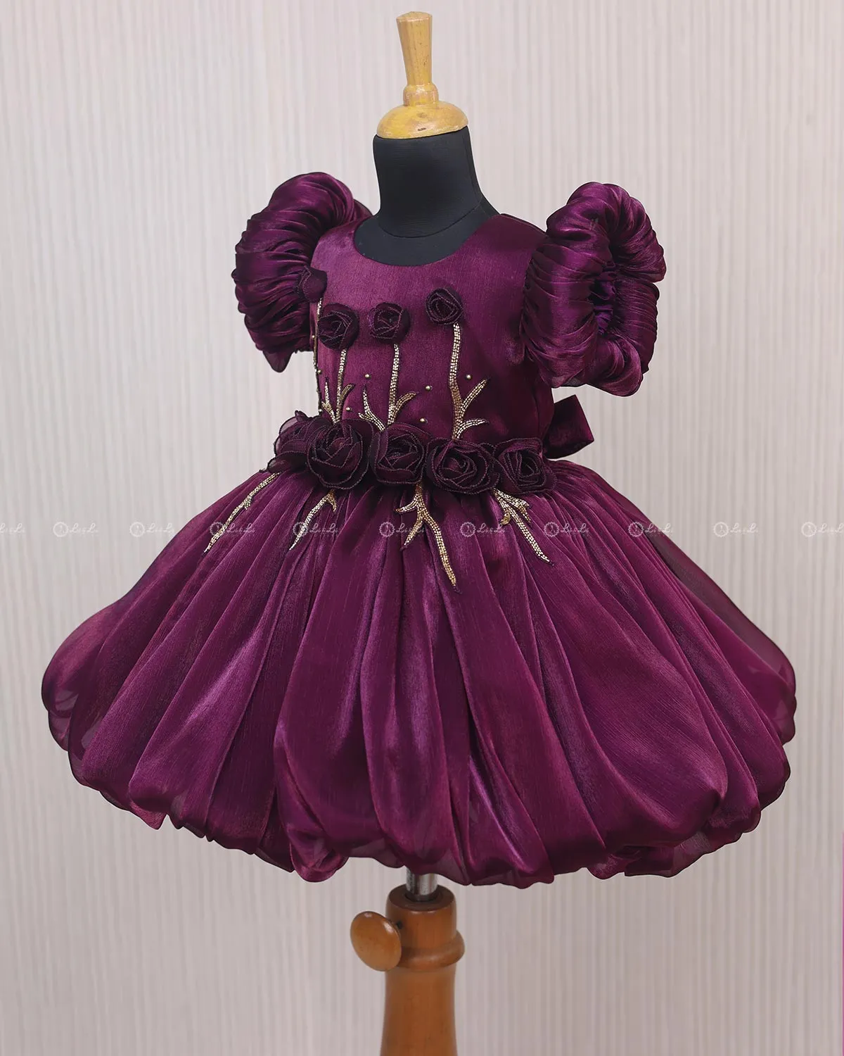 Plum Purple Balloon Gown with Handcrafted Rose Embellishment.